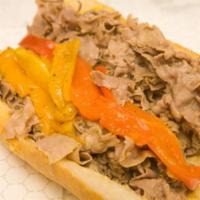 Italian Beef Sandwich · Dipped in natural gravy and includes your choice peppers. Served on freshly baked French bre...
