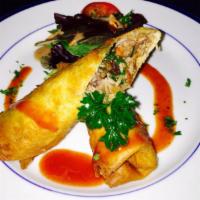 Cuban Egg Rolls · Rollito Cubano. With pulled pork or shredded beef. Crispy with black beans, cilantro, drizzl...