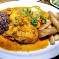 Cuban Chicken Stew · Fricase de pollo. Stewed chicken pieces in a lightly spiced tomato sauce with potatoes, oliv...