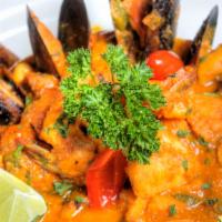 Seafood Medley Stew · Enchilado de mariscos. Combination of Seafood and market fish in a spiced sofrito tomato sau...