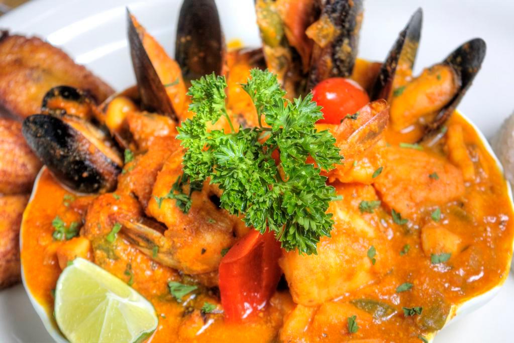 Seafood Medley Stew · Enchilado de mariscos. Combination of Seafood and market fish in a spiced sofrito tomato sauce.