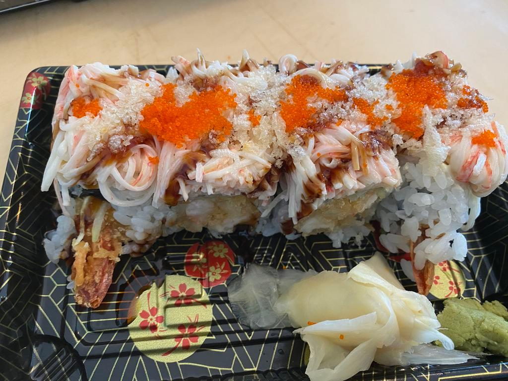 Dynamite Special Roll · Shrimp tempura cucumber inside topped with kani salad eel sauce crunch and masago