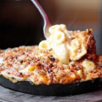 Half Baked Mac & Cheese. · Our famous creamy mac & cheese oven baked in a cast iron skillet & topped w/ our grass-fed b...