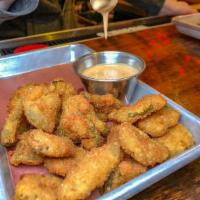 Fried Pickles. · Sliced dill pickles fried in our favorite beer batter. Served with our house made BBQ aioli.