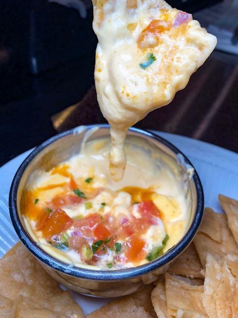 Chef's Queso. · Our fresh made spicy cheese sauce & fresh cut pico de gallo and served with our house made corn tortilla chips.