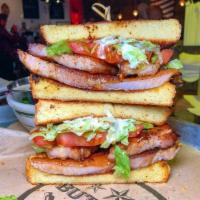 PBLT. · House made smoked pork belly grilled to perfection. Served w' lettuce, tomato and mayonnaise...