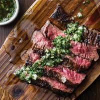 Marinated Grilled Skirt Steak. · Marinated over night, grilled on a cast-iron skillet and served with  our flavourful house m...