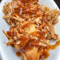 Pulled BBQ Chicken. · Braised chicken thighs smothered in our original BBQ sauce.