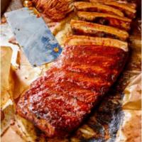 Dry-Rub Ribs · 4 slow-cooked, meaty St. Louis style pork spare ribs. Dry rubbed with premium warm asian spi...