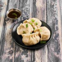 Steamed Dumplings 蒸饺 · 4 pieces.