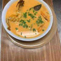Sopa de Mariscos · Soup made with crab, mackerel fish, shrimp, seafood mix, and heavy cream. Served with 2 tort...