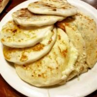 Frijol con Queso Pupusa · Cheese and beans. Corn or rice.