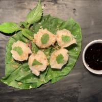 Shrimp Dumpling - 5 pieces · Thai take on a classic Chinese dim sum dish. Served with soy vinaigrette dip on the side.