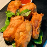 Chicken Wings · Lightly battered & crispy fried, served with Thai sweet chili sauce on the side.
