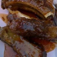 Baby Back Pork Ribs · Fried marinated pork ribs glazed with Thai sweet chili sauce.