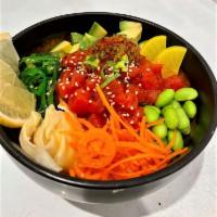 Tuna Poke Bowl · Fresh raw tuna, sushi rice, pickled ginger, seaweed salad, avocado, pickled daikon, carrots,...