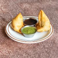 Vegetable Samosa · Crispy turnovers stuffed with mildly spiced potatoes & green peas. Most popular appetizer. V...