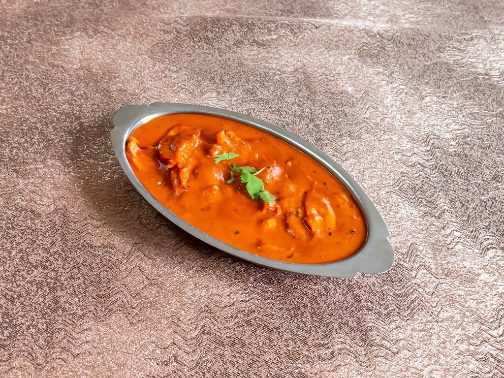 Chicken Tikka Masala · Chicken breast barbecued and cooked in creamy sauce with chopped bell pepper.