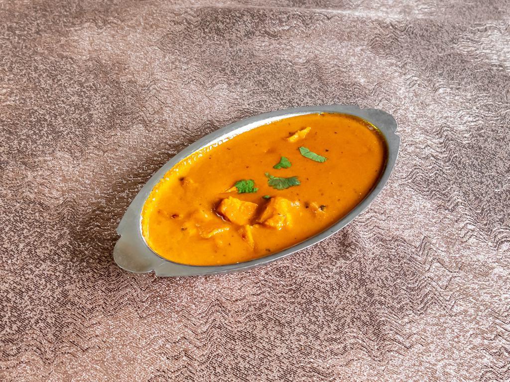 Butter Chicken  · Boneless chicken barbecued and cooked in creamy tomato sauce.