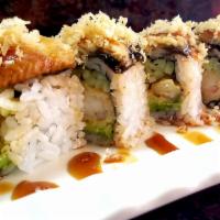 Dragon Roll · Tempura shrimp, snow crab inside, topped with unagi, avocado, eel sauce and masago.