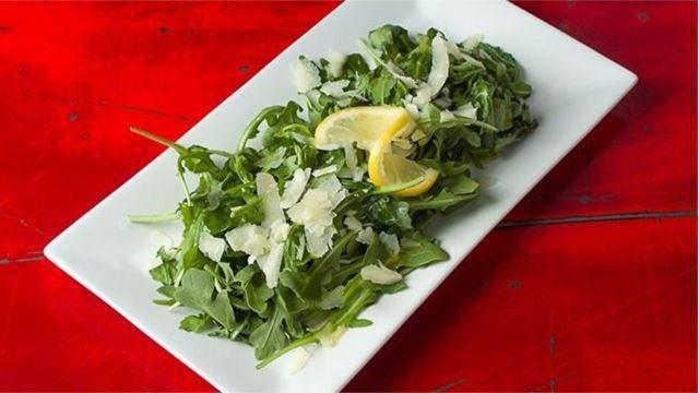 Arugula Salad · Wild arugula, shaved pecorino, lemon infused olive oil from Sorrento and a squeeze from a fresh lemon.