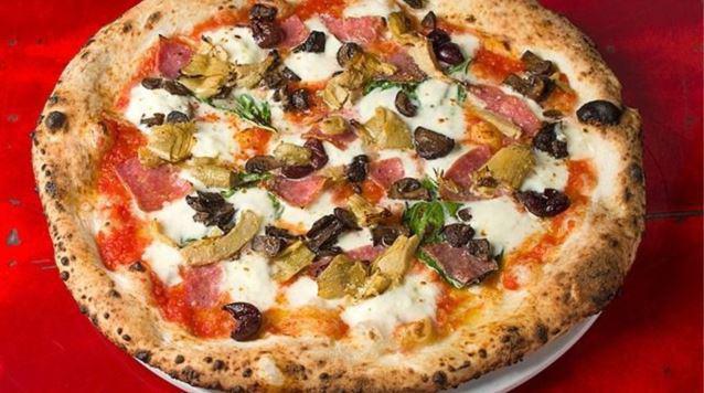 Amore Mio Pizza · Fresh mozzarella, roasted artichokes, artisanal salami, mushrooms, black olives, Pecorino Romano and basil.