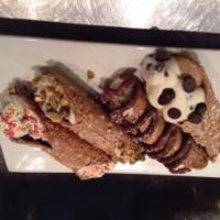 Build Your Own Cannoli · Fresh cannoli shell filled with Italian ricotta and choice of topping.