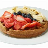 High Protein Whole Wheat Waffle · Made with Ten Fruits's almond milk and IsoPure whey protein. Topped with blueberries, strawb...