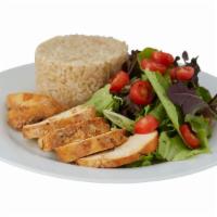 Roasted Chicken with Brown Rice and Salad · Peruvian-style roasted sliced chicken breast served with baby greens salad and whole grain b...