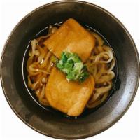 Kitsune Udon · Japanese style udon noodle soup with deep fried bean curd and topped with scallion. 