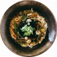 Sansai Udon · Japanese style udon noodle soup topped with Japanese wild vegetables, seaweed, and scallion.