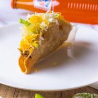 Beef Taco · One Taco 
Crispy Shell Shredded Beef Taco topped with Lettuce and Cheese