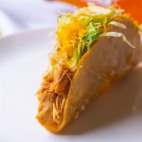 Chicken Taco · One Taco 
Crispy Shell Shredded Chicken Taco topped with Lettuce and Cheese