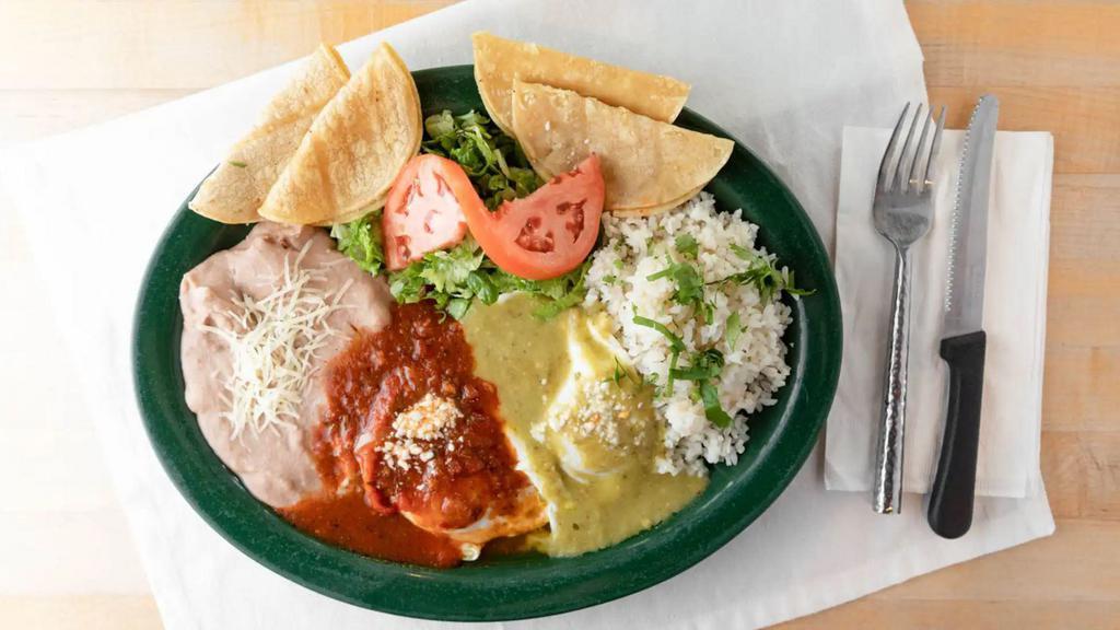 Huevos Rancheros · Your choice of eggs topped with our homemade ranchero sauce. Served with rice, beans and tortillas.