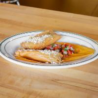 Homemade Tamales · Voted some of the best tamales in Milwaukee masa cornmeal, your choice of filling, steamed i...