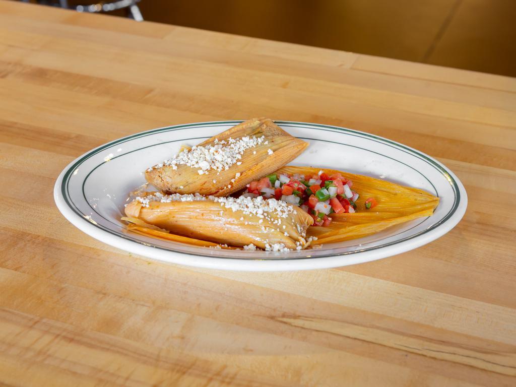 Homemade Tamales · Voted some of the best tamales in Milwaukee masa cornmeal, your choice of filling, steamed in a corn or plantain husk, garnished with pico de gallo and anejo cheese.