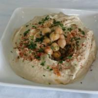 Hummus (V&GF) · Cooked chickpeas, mixed with tahini sauce, lemon juice and spices, served with 1 pita bread.