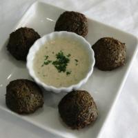 Falafel (V&GF) · 5 golden brown pieces of homemade felafel made with ground chickpeas, spices and herbs, serv...