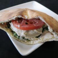 Vegetarian Pita Sandwich (V) · Hummus, tabbouleh, lettuce, tomato, onion, and tahini sauce.