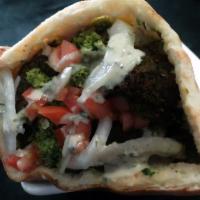 Falafel Sandwich (V) · Falafel, hummus, tabbouleh, lettuce, tomato, onion and tahini sauce.