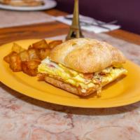 Breakfast Omelet Sandwich · Egg and cheese omelet with choice of bacon, ham, or sausage served on choice of bagel, break...
