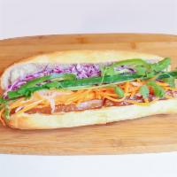 Pork Belly Banh Mi · Caramelized pork belly, mayo and purple slaw. Served with pickled carrots and daikon, cucumb...