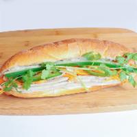 Pork Roll Banh Mi · Steamed pork roll, pate and mayo. Served with pickled carrots and daikon, cucumber, jalapeno...