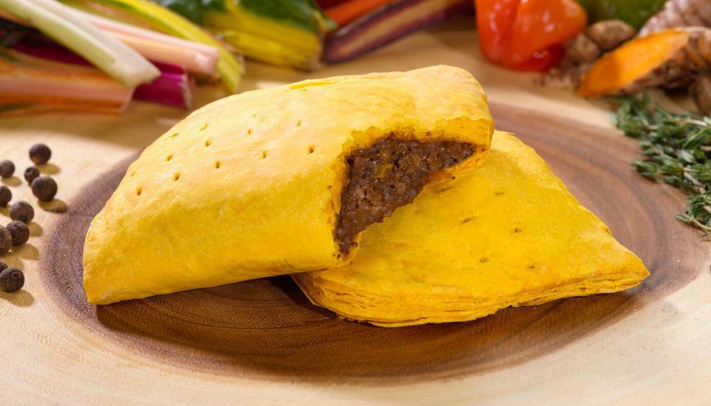 Spicy Beef Patty · Savory, flavorful spicy mild ground beef wrapped in flaky layers of our signature golden crust. A Jamaican classic.