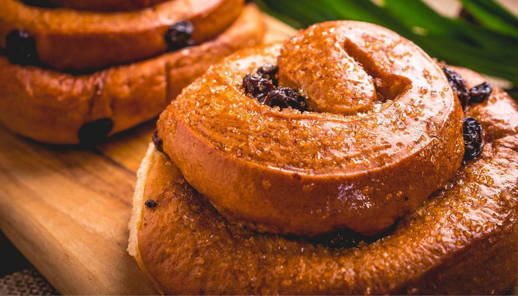 Sugar Bun · A rich, cinnamon-swirled pastry coated in warm butter and brown sugar.
