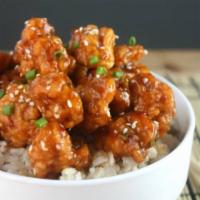 Orange Chicken · Served with Steamed Rice and Mixed Steamed Veggies.