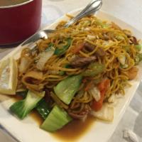 Pancit Canton · Sauteed egg noodles cooked with vegetables, pork, shrimp and Chinese sausage.