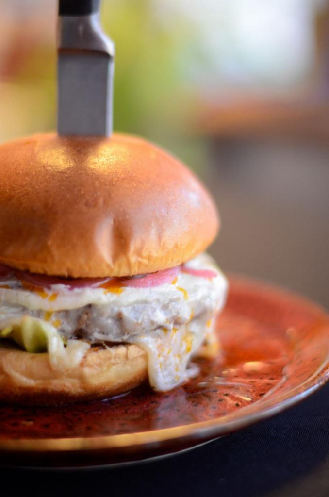 El Jim Burger · Provolone cheese, Gorgonzola mousse, pickled red onions and habanero butter.