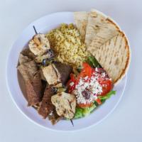 Zorbas Platter · Gyros meat and a skewer. Choice of 2 side dishes: Greek salad, rice pilaf, fries or black be...