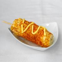 Elote · Sweet corn, butter, mayonnaise, topped with Cotija cheese and Chile